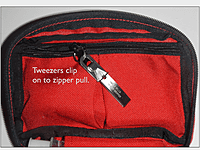 Uncle Bill’s Silver Gripper Tweezers clip onto zipper pull