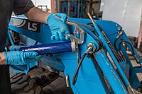 Lincoln 1133 Pistol Grip Grease Gun with 18" Whip Flex Hose and Coupler, 2-Way Loading, 6,000 PSI, One-Hand Operation