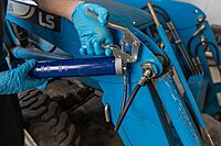 Lincoln 1133 Pistol Grip Grease Gun with 18" Whip Flex Hose and Coupler, 2-Way Loading, 6,000 PSI, One-Hand Operation