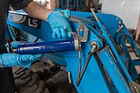 Lincoln 1133 Pistol Grip Grease Gun with 18" Whip Flex Hose and Coupler, 2-Way Loading, 6,000 PSI, One-Hand Operation