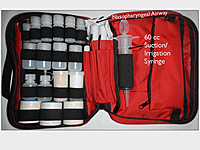 The inside of the 7 x 10.5 inch Expedition Pack showing a 60cc suction syringe