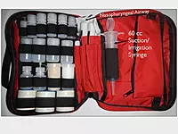 The inside of the 7 x 10.5 inch Expedition Pack showing a 60cc suction syringe