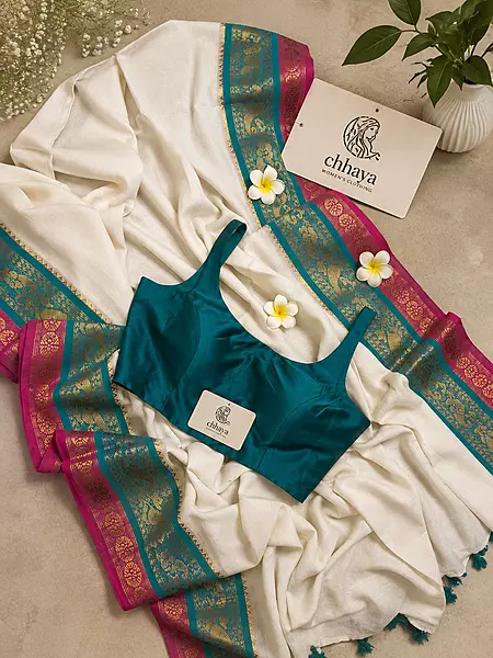 off-white Mulcotton saree with a vibrant teal and pink border