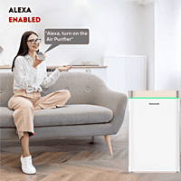 Compact Honeywell Air Touch U2 Air Purifier sitting on a tabletop next to a houseplant. Compact Honeywell Air Touch U2 Air Purifier sitting on a tabletop next to a houseplant.