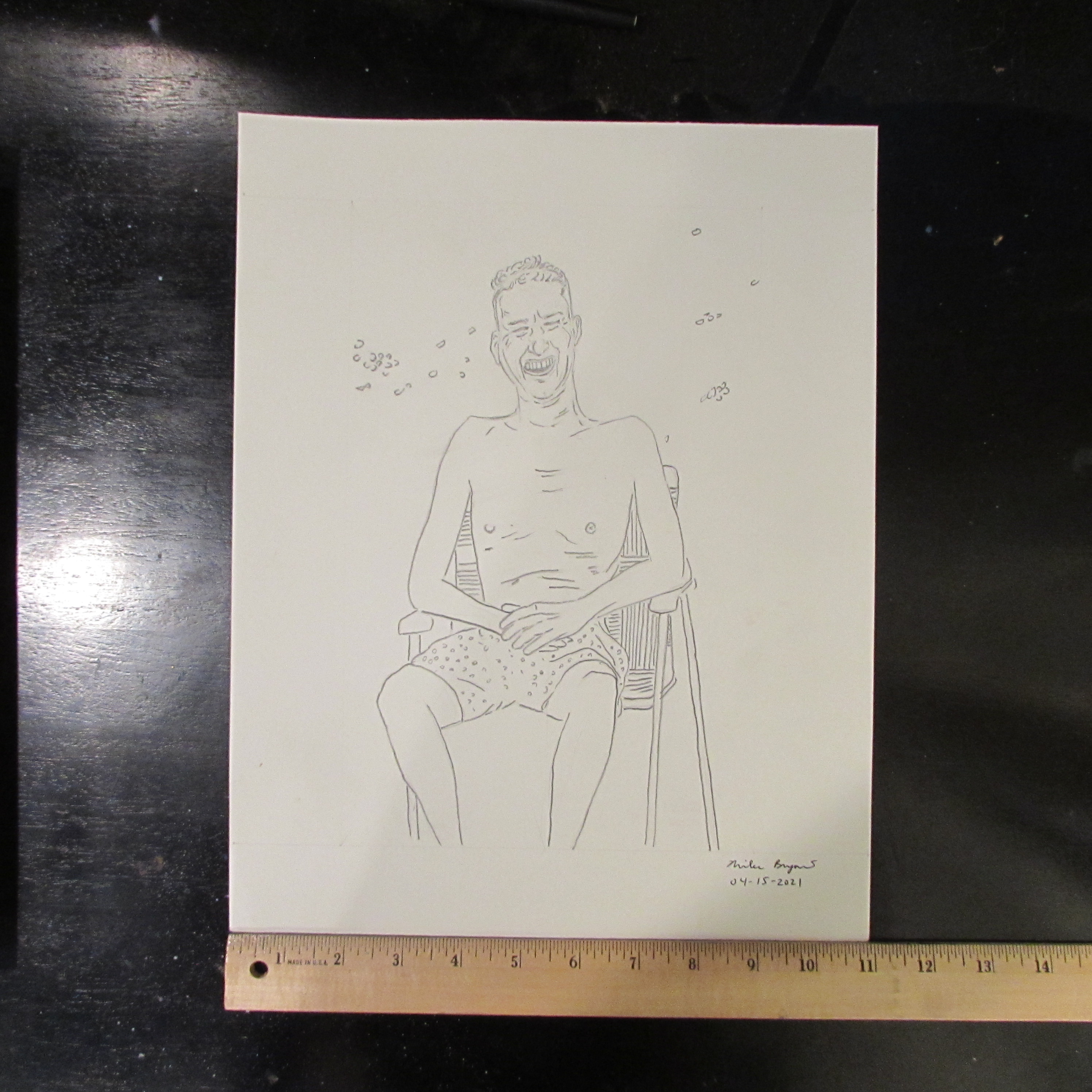 Man in chair drawing