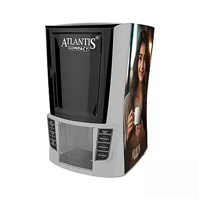 A person dispensing a fresh cup of coffee from the easy-to-use Atlantis Compact machine. A person dispensing a fresh cup of coffee from the easy-to-use Atlantis Compact machine.