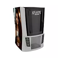 The sleek and Atlantis Compact 2 Lane Hot Beverage Vending Machine on an office countertop.