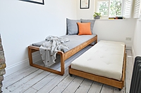 Wooden Sofa Cum Bed with Pull-Out Trundle – Space-Saving Daybed for Home & Guests Wooden Sofa Cum Bed with Pull-Out Trundle – Space-Saving Daybed for Home & Guests
