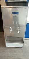 The Blue Star logo and model number SWCSDLX6080UVROE clearly displayed on the stainless steel unit. The Blue Star logo and model number SWCSDLX6080UVROE clearly displayed on the stainless steel unit.