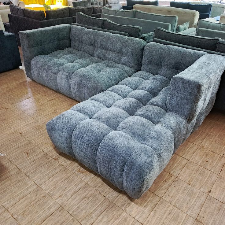 Contemporary Lshaped bubble sofa wit plush cushions and modern design.