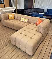 Contemporary Lshaped bubble sofa wit plush cushions and modern design.