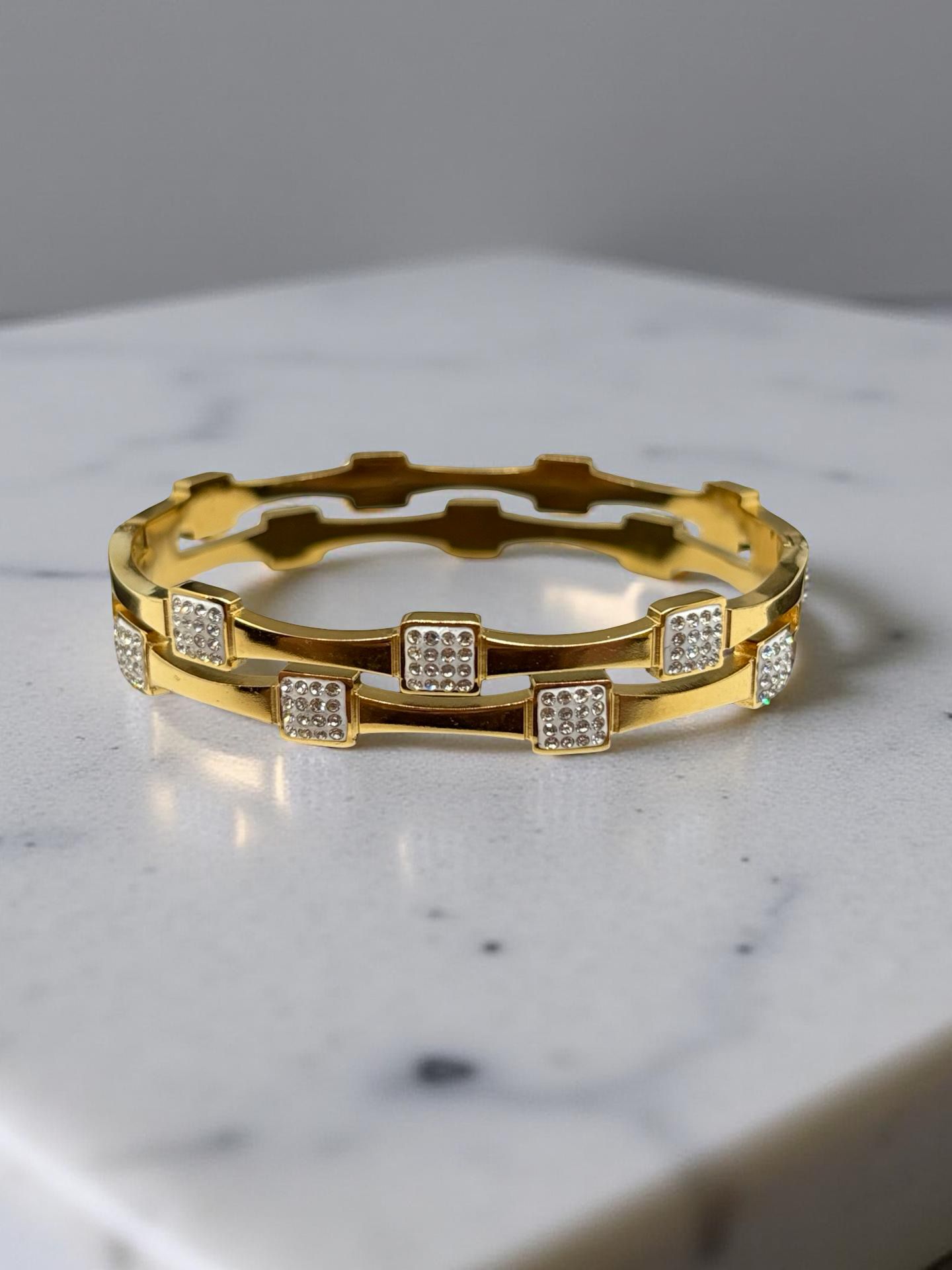Modern Statement Gold Bangle with Square Zirconia Accents