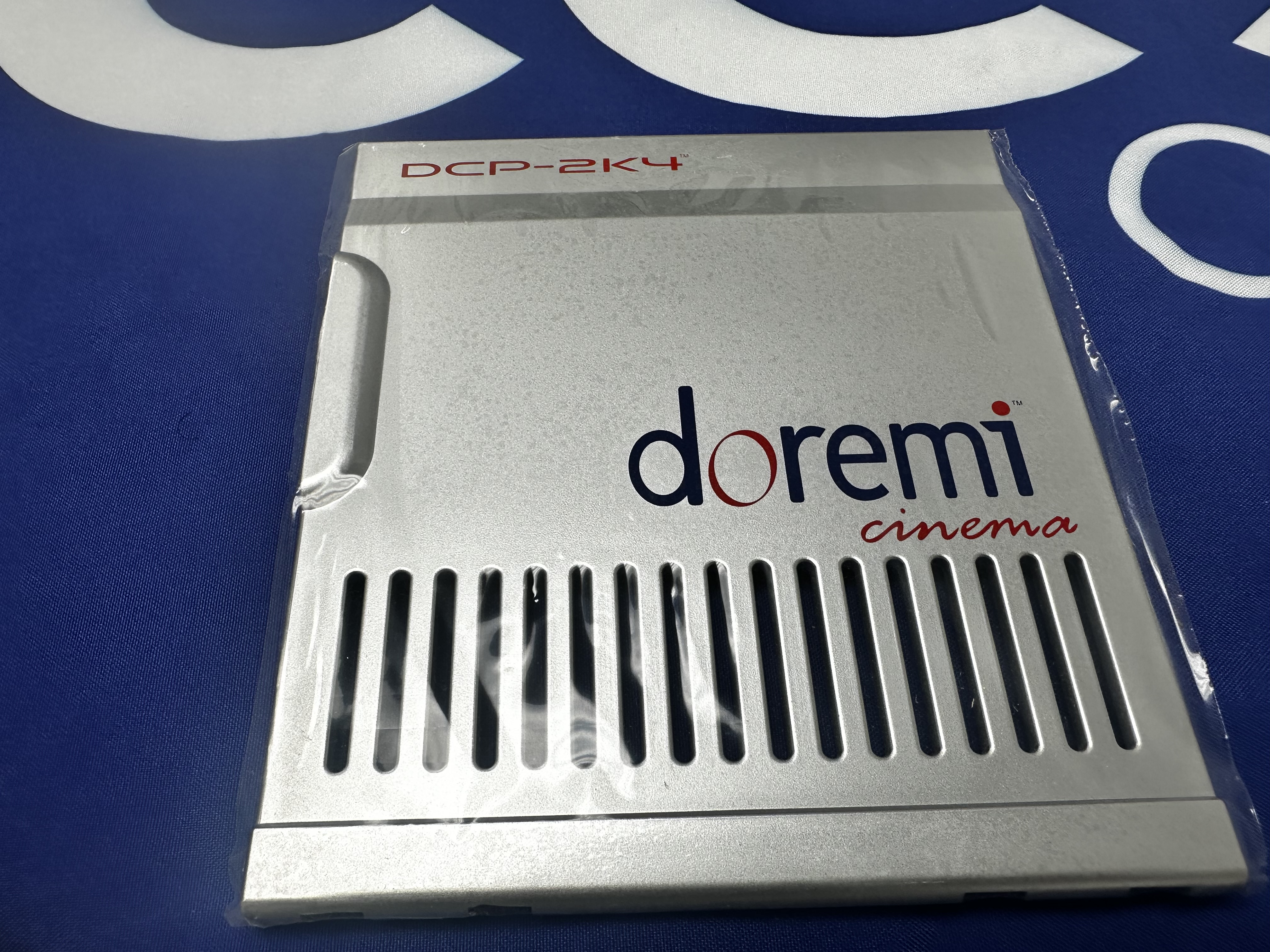 Dolby PLC-DCP4U-FP-BEZEL PLASTIC FRONT PANEL BEZEL W/DOREMI LOGO