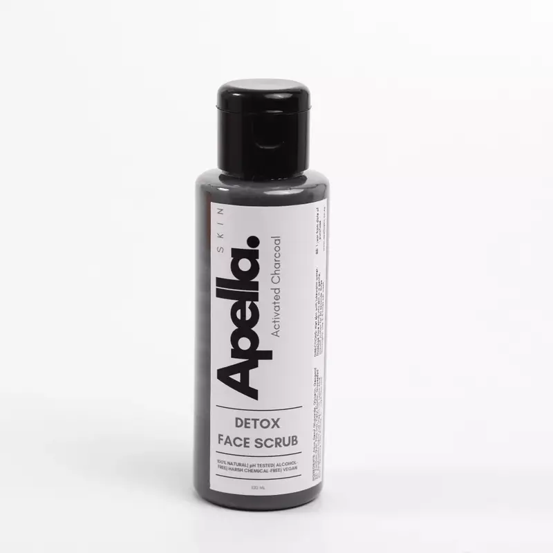 A bottle of Apella Skins Detox Charcoal Face Scrub which helps reduce acne and clogged pores.