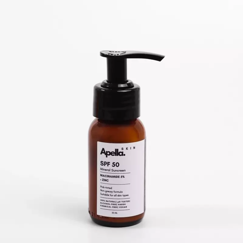 Bottle of Apella Skin SPF 50 mineral sunscreen with Niacinamide and Zinc. Labelled as non-greasy.