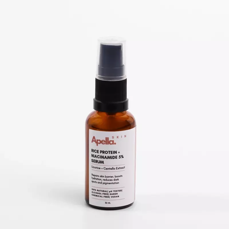A bottle of rice protien and niacinamide serum. This is a Korean skincare beauty product.
