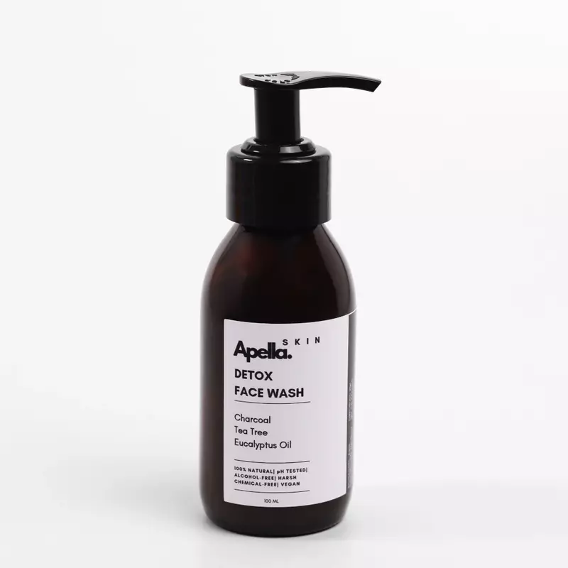 Bottle of a Detox Face Wash, featuring charcoal and tea tree to treat acne-prone skin.