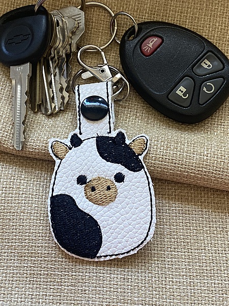 Squishy Cow Keychain: Embroidered Faux Leather Snap Tab