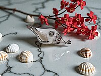 Shell Pendant with Silver Accents and Red Gemstones