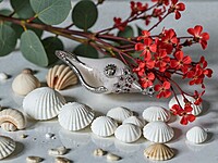 Shell Pendant with Silver Accents and Red Gemstones