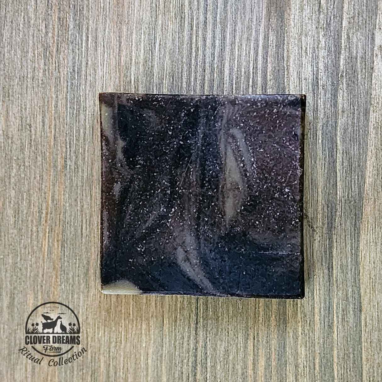 Unboxed True North goat milk soap with dark brown and green swirls