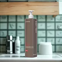 Applying Versum shampoo before washing hair