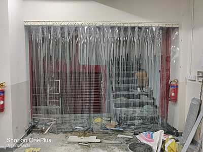 Buzz Lite PVC Strip Curtain installed at the entrance of a retail store. Buzz Lite PVC Strip Curtain installed at the entrance of a retail store.