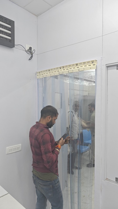 Buzz lite Climate Control Pvc strip curtain a visible door.