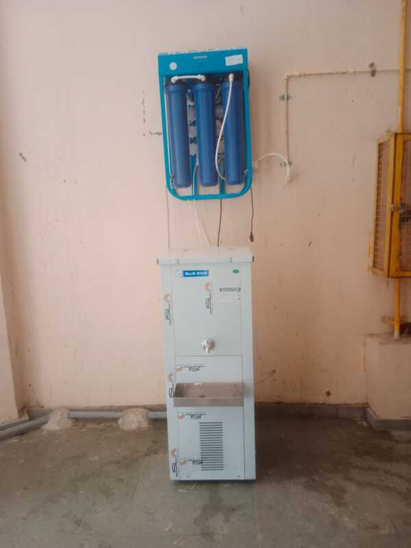 An authorized technician performing installation of the Power Jal Reverse Osmosis Water Purifier.