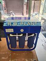 A sleek & Compact Under Sink Water Purifier mounted on a modern kitchen countertop. A sleek & Compact Under Sink Water Purifier mounted on a modern kitchen countertop.