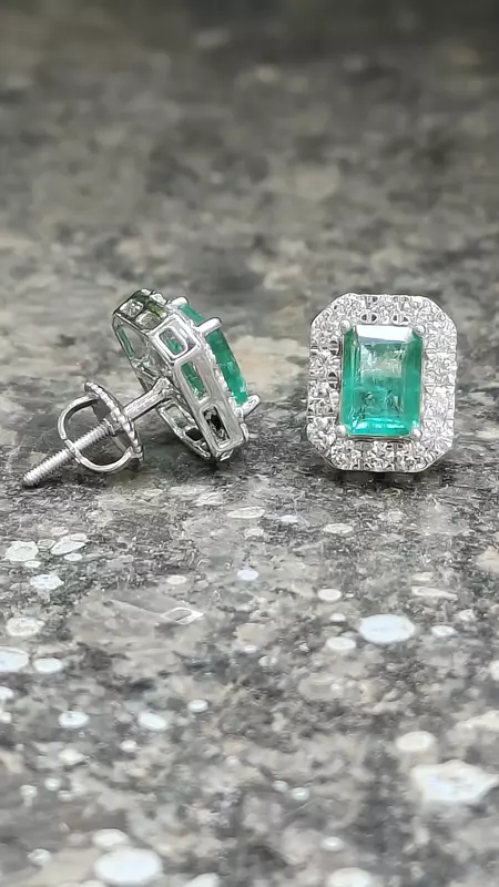 Green emerald with halo of diamond ear studs