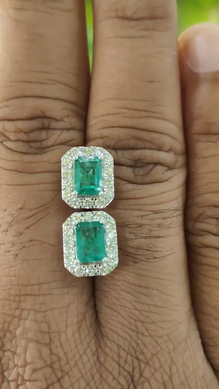 Green emerald with halo of diamond ear studs