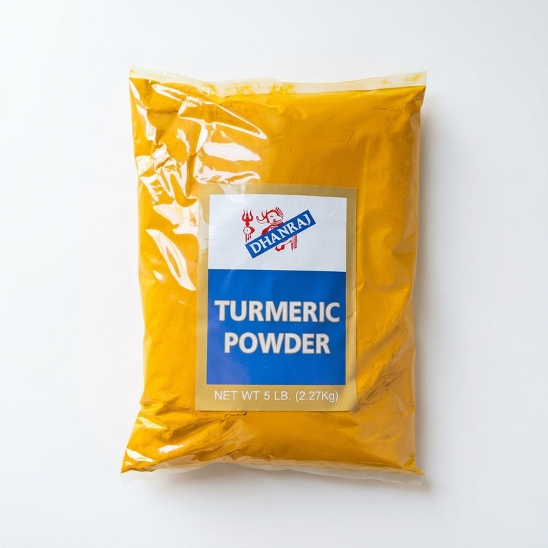 Dhanraj Turmeric Powder a vibrant, deep golden-yellow ground spice for cooking and wellness