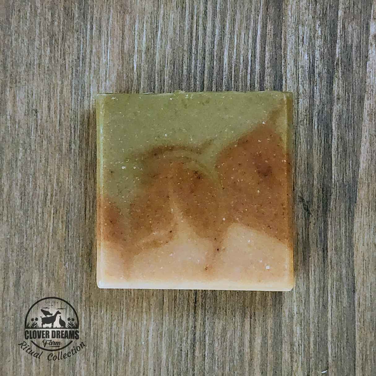 Unboxed Wildflower goat milk soap with soft green, cream, and golden swirls