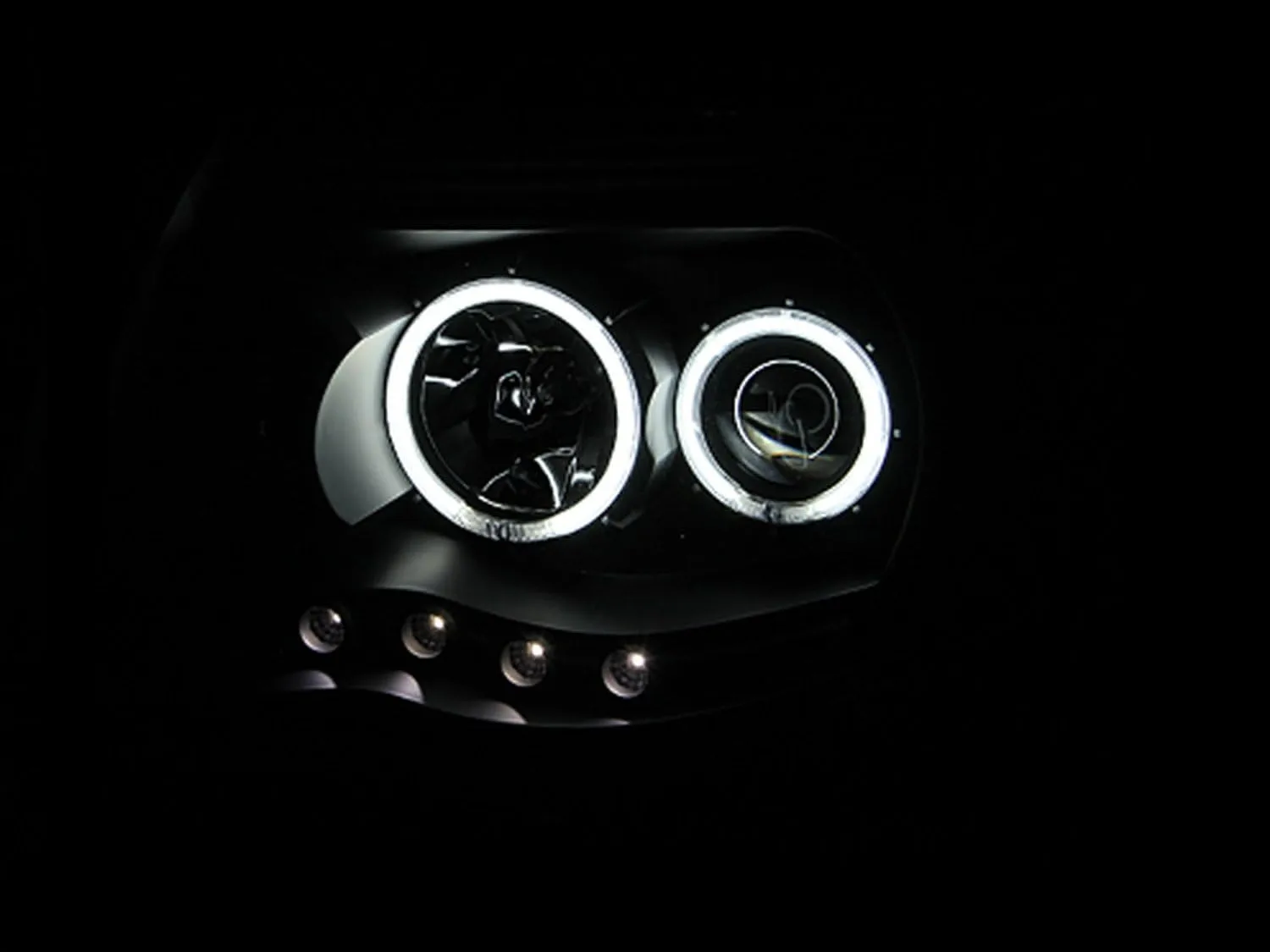 AnzoUSA 121282 Black Clear Projector Halo Headlight for Toyota Tacoma - (Sold in Pairs)