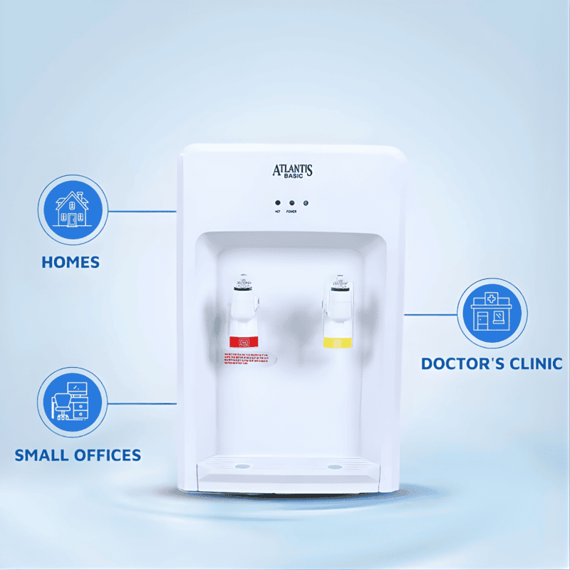 Portable Atlantis Basic Mini water dispenser standing next to a glass of fresh water.