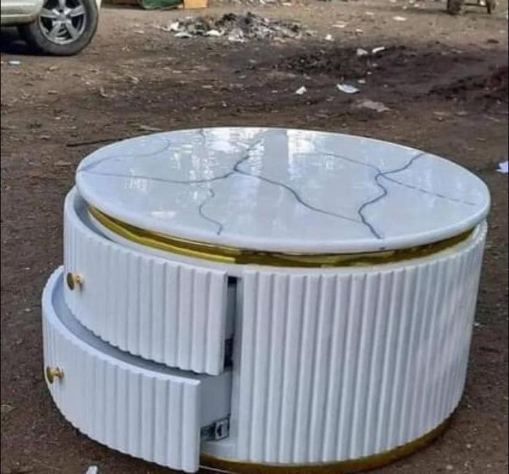 white coffee table with a mable top