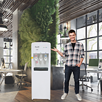 Employees gathering around the Atlantis Frosty Plus Water Dispenser in an office breakroom. Employees gathering around the Atlantis Frosty Plus Water Dispenser in an office breakroom.