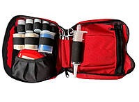 The inside of the 6.5 x 8.5 inch Guide Pack showing a 60cc suction syringe