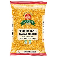 8lb bag of Laxmi Toor Dal with a traditional oily coating for natural preservation and rich flavor