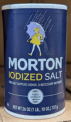 1lb canister of Morton Iodized Salt, a fine-grained, all-purpose table salt fortified with iodine.