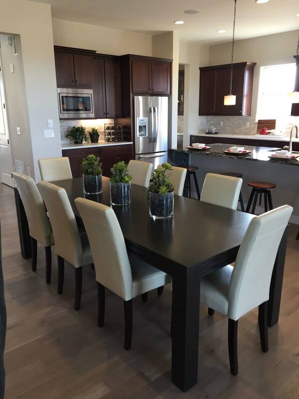 Mahogany dining table with cushioned  chairs.