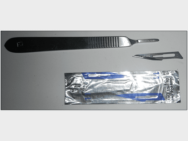Scalpel blade shown with Handle (sold separately)