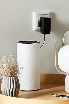 TP‑LINK Deco M4 placed on a home shelf, boosting internet signal 200 mesh Wi‑Fi.