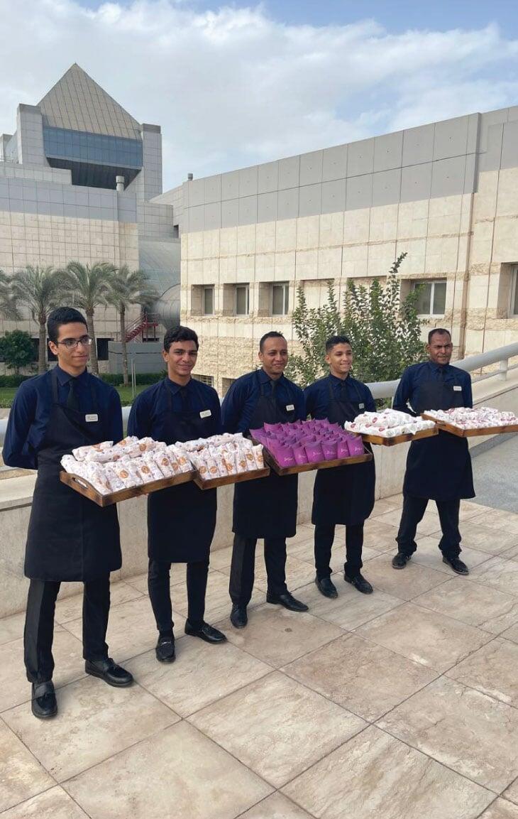 LOriental waiters getting ready for service at a CSR event by SADKO in NMEC