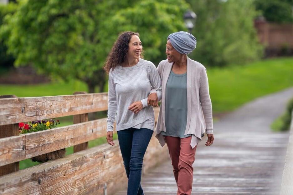 Cancer survivor walking comfortably outdoors after improvement in neuropathy symptoms Cancer survivor walking comfortably outdoors after improvement in neuropathy symptoms