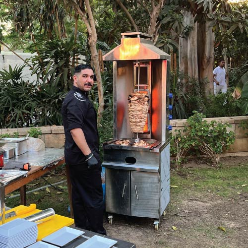 LOriental chef at live shawarma station LOriental chef at live shawarma station